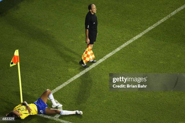 Rivaldo of Brazil lies on the ground after being struck by the ball during the Group C match against Turkey at the World Cup Group Stage played at...