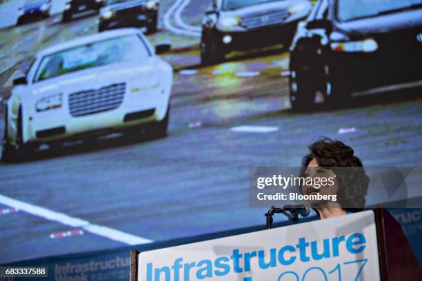 Elaine Chao, U.S. Secretary of transportation, speaks in front of a photograph following repairs of Atlantas I-85 bridge during the Infrastructure...