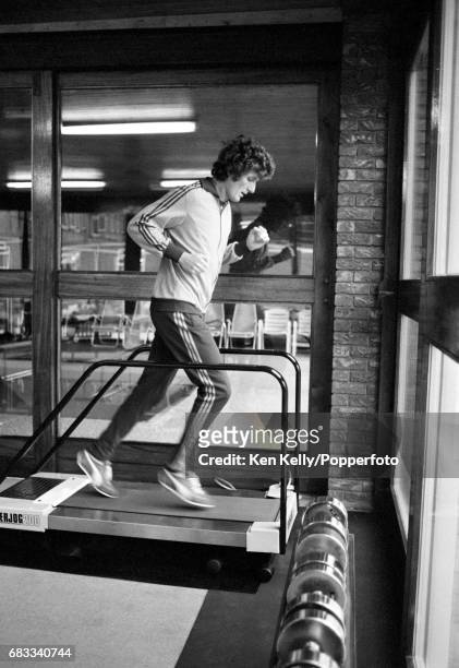 Warwickshire and England bowler Bob Willis exercises on a running machine in the Health Clinic run by England physiotherapist Bernard Thomas at...