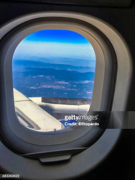 pov of an airplane window - wings circle stock pictures, royalty-free photos & images