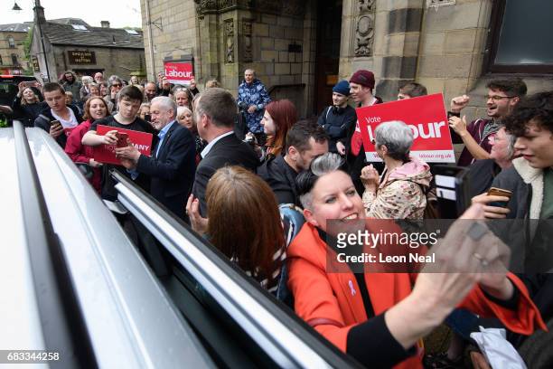 Woman takes a selfie as Leader of the Labour Party Jeremy Corbyn departs after speaking to hundreds of people who attended an election rally on May...