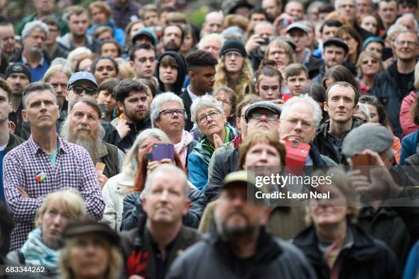 Supporters listen as Leader of the Labour Party Jeremy Corbyn speaks to hundreds of people who attended an election rally on May 15, 2017 in Hebden...