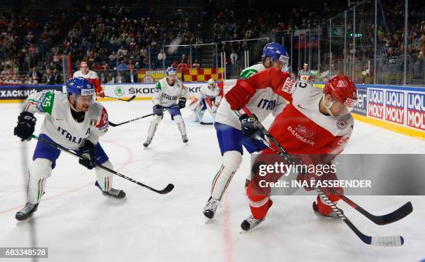 Denmark´s Mads Christensen vie with Italy´s Stefano Marchetti and Alexander Egger vie during the IIHF Men's World Championship ice hockey match...