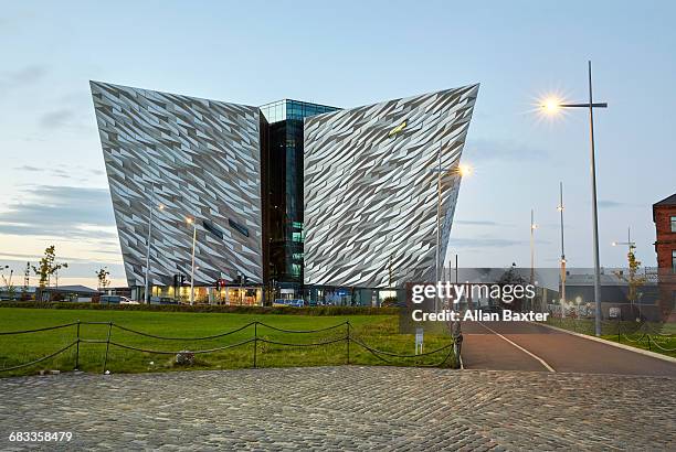 facade of the titanic belfast visitor centre - titanic belfast stock pictures, royalty-free photos & images