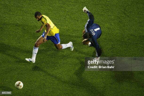 Rivaldo of Brazil slips past the Turkish Goalkeeper Rustu Receber during the Group C match of the World Cup Group Stage played at the Ulsan-Munsu...