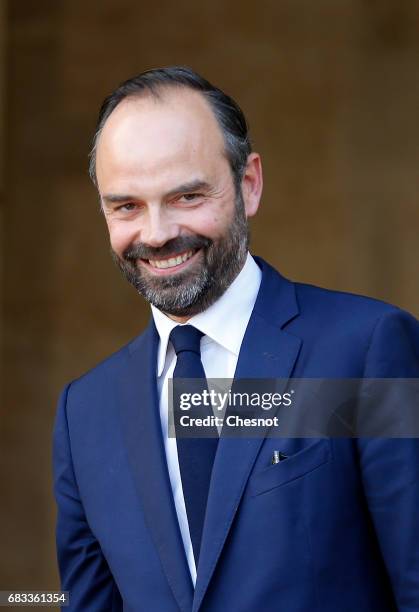 France's newly-appointed Prime Minister Edouard Philippe attends an official handover ceremony with outgoing Prime Minister Bernard Cazeneuve at...