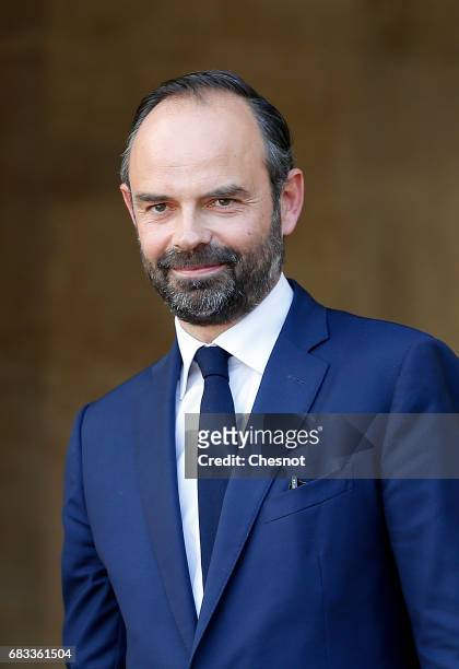 France's newly-appointed Prime Minister Edouard Philippe attends an official handover ceremony with outgoing Prime Minister Bernard Cazeneuve at...