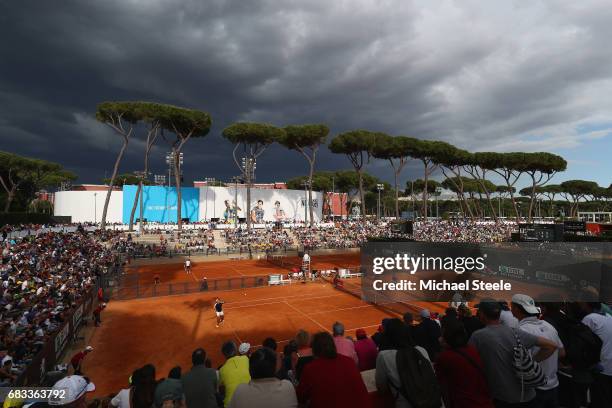 General view as storm clouds gather over court one during the second round match between Robin Haase of Holland and Carlos Berlocq of Argentina on...