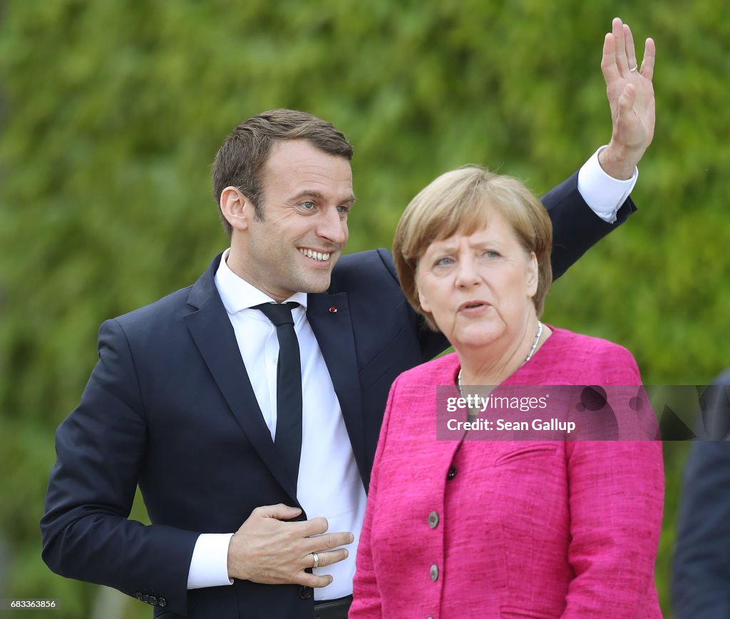 French President Emmanuel Macron Meets Angela Merkel In Berlin