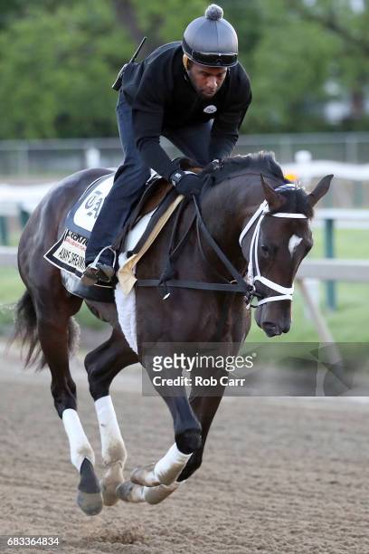 Exercise rider Nick Bush rides Kentucky Derby winner Always Dreaming as he trains on the track for the upcoming Preakness Stakes at Pimlico Race...