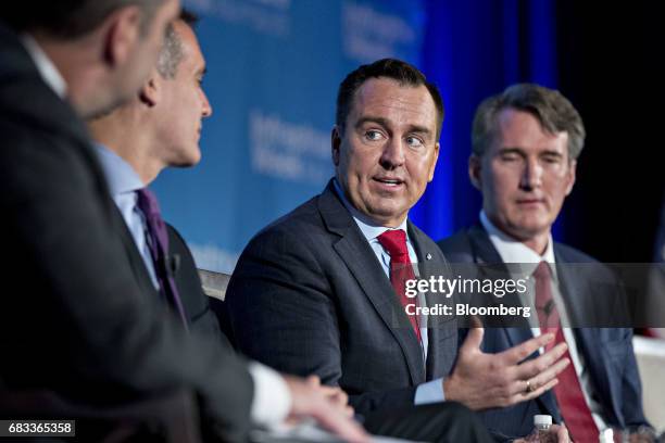 Gregory Hughes, speaker of the Utah state legislature, speaks as Glenn Youngkin, president and chief operating officer of the Carlyle Group, right,...