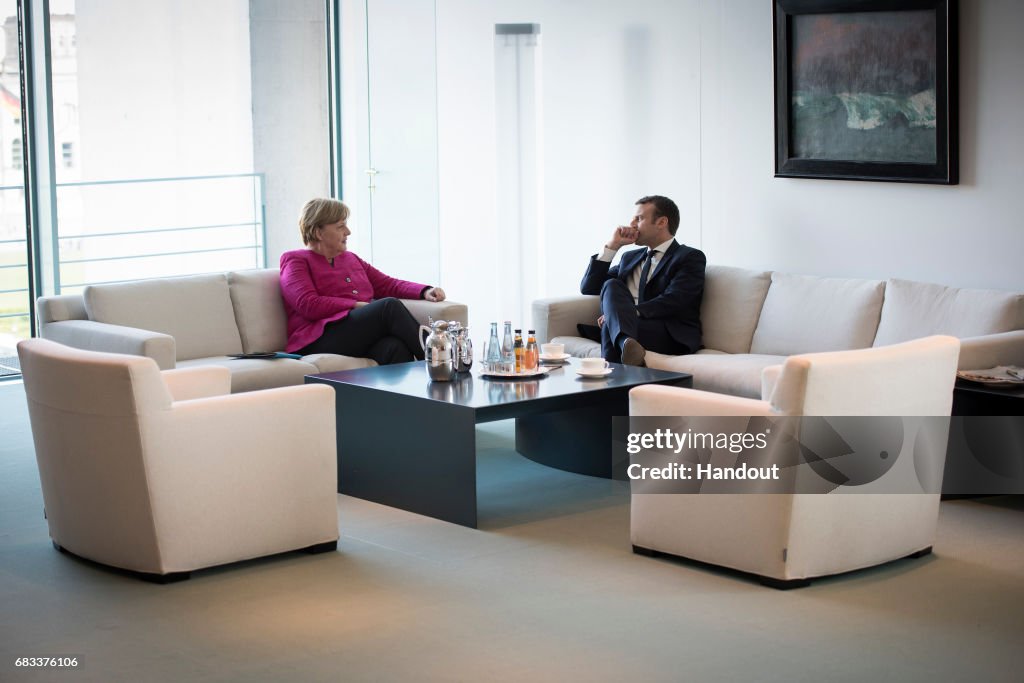 French President Emmanuel Macron Meets Angela Merkel In Berlin