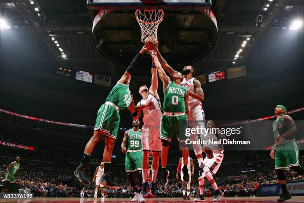 Markieff Morris of the Washington Wizards fights for the rebound against Avery Bradley of the Boston Celtics and dance team performs during Game Six...