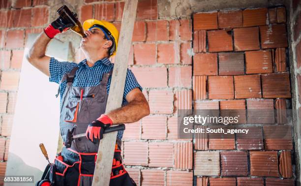 construction site worker on break - screwdriver drink stock pictures, royalty-free photos & images