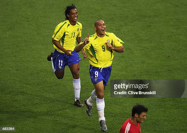 Ronaldo of Brazil celebrates scoring the equalising goal against Turkey with team mate Ronaldinho during the Group C match of the World Cup Group...