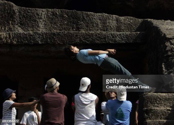 Rucha, a student of St. Xaviers College during a trustfalling exercise at a camp at the Kanheri Caves, Sanjay GandhiNational Park, borivali on sunday