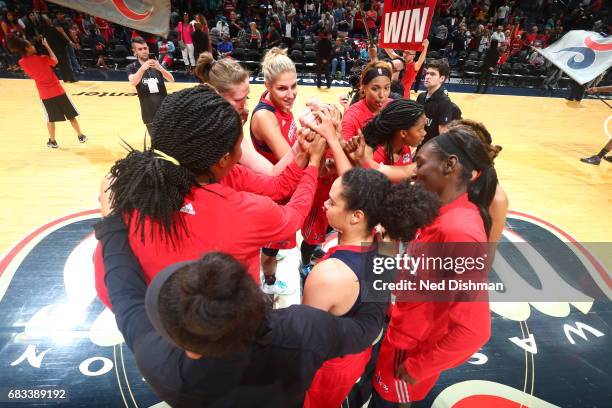 Elena Delle Donne of the Washington Mystics huddles with teammates during the game against the San Antonio Stars on May 14, 2017 at Verizon Center in...