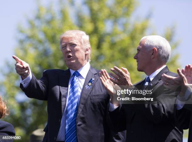 President Donald Trump gestures as U.S. Vice President Mike Pence, right, applauds during the 36th Annual National Peace Officers' Memorial Service...