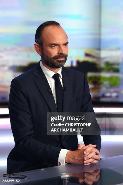 France's newly appointed Prime Minister Edouard Philippe poses prior to taking part in the evening news broadcast of French TV channel TF1, on May 15...