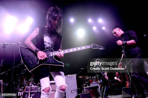 Guitarist Jake Pitts of Black Veil Brides and singer Jonny Sculls of PVSHER performs onstage during the "Strange 80's" benefit at The Fonda Theatre...