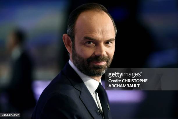 France's newly appointed Prime Minister Edouard Philippe poses prior to taking part in the evening news broadcast of French TV channel TF1, on May 15...
