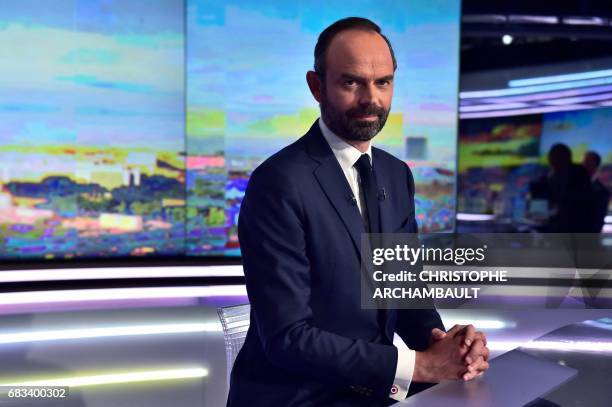 France's newly appointed Prime Minister Edouard Philippe poses prior to taking part in the evening news broadcast of French TV channel TF1, on May 15...