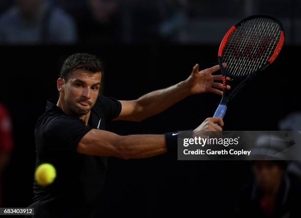 Grigor Dimitrov of Bulgaria plays a shot during his first round match against Juan Martin Del Potro of Argentina in The Internazionali BNL d'Italia...