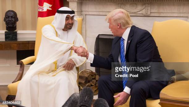 President Donald Trump welcomes Crown Prince Shaikh Mohammad bin Zayed Al Nahyan of Abu Dhabi in the Oval Office of the White House on May 15, 2017...