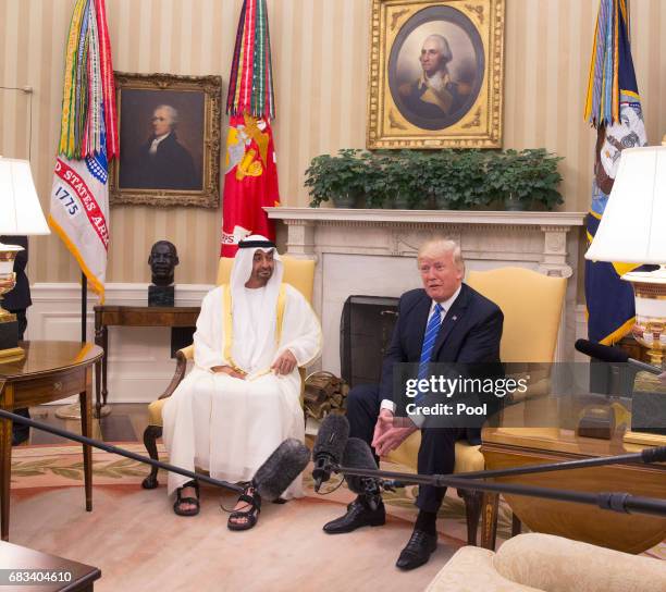 President Donald Trump welcomes Crown Prince Shaikh Mohammad bin Zayed Al Nahyan of Abu Dhabi in the Oval Office of the White House on May 15, 2017...