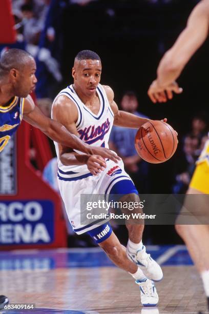 Spud Webb of the Sacramento Kings shoots against the Portand