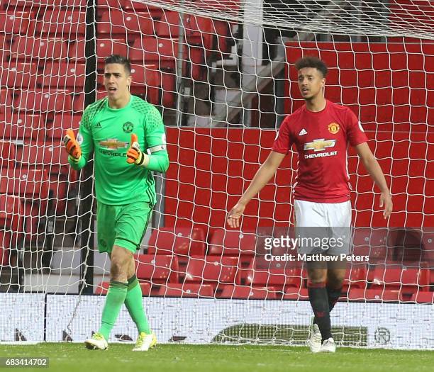 Joel Pereira and Cameron Borthwick-Jackson of Manchester United U23s react to Samuel Shashoua of Tottenham Hotspur scoring their second goal during...