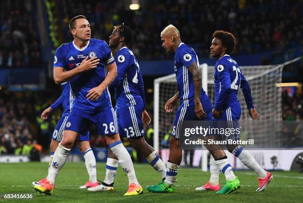 John Terry of Chelsea celebrates scoring his sides first goal with his Chelsea team mates during the Premier League match between Chelsea and Watford...