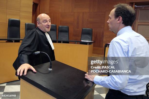 Bastia prosecutor Nicolas Bessone speaks with French Football Federation lawyer Benjamin Peyrelevade during the opening of the trial of 15 people...