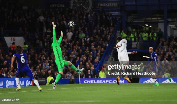 Etienne Capoue of Watford scores his sides first goal past Asmir Begovic of Chelsea during the Premier League match between Chelsea and Watford at...