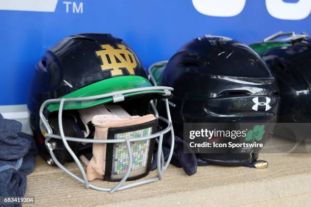 Notre Dame batting helmets in the dugout. The Boston College Eagles played the University of Notre Dame Fighting Irish on May 11 at Anderson Softball...