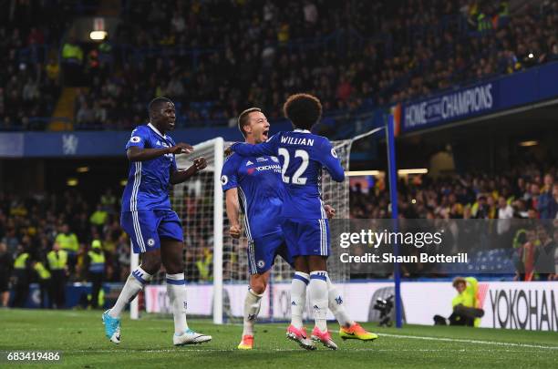 John Terry of Chelsea celebrates scoring his sides first goal with Willian of Chelsea and Kurt Zouma of Chelsea during the Premier League match...