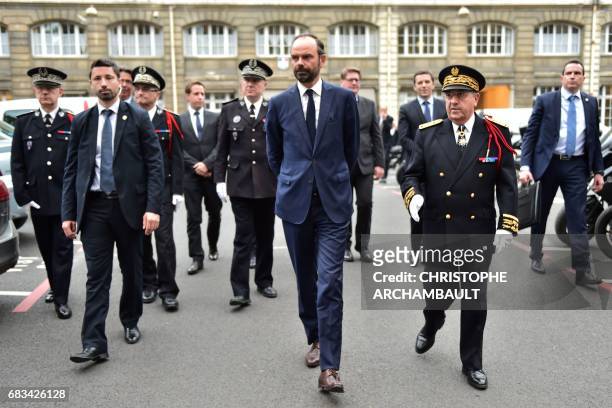 France's newly appointed Prime Minister Edouard Philippe walks with Ile-de-France prefect Michel Delpuech during his first official visit at the...