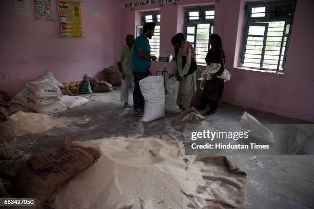 Villager collects relief provided by the government at relief camp on May 15, 2017 in Nowshera, India. The Pakistan Army resorted to mortar shelling...