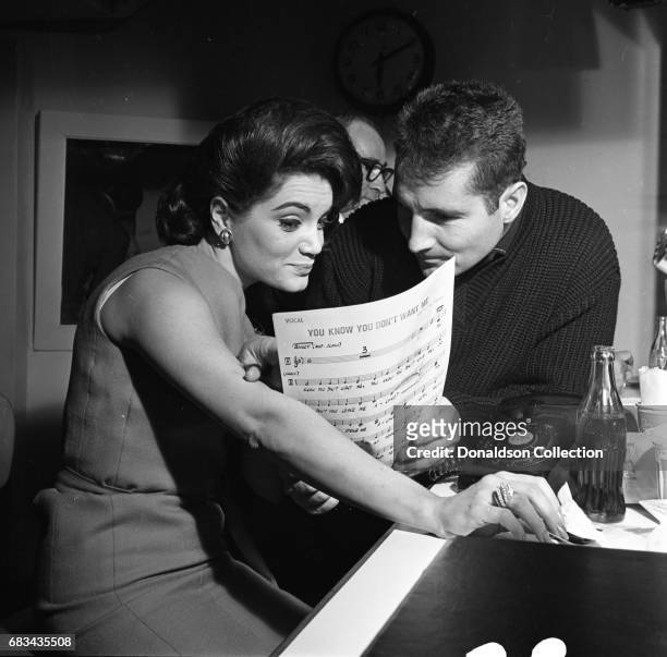 Entertainer Connie Francis records the song "You Know You Don't Want Me" in the studio with Freddy Quinn at MGM on January 4, 1963 in New York.