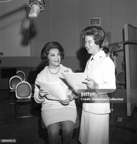 Entertainer Connie Francis with a nurse at NBC Central Studio A on May 31, 1966 in New York.
