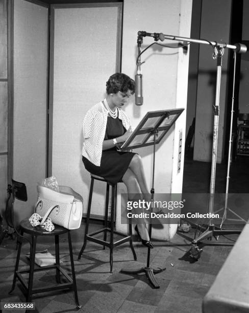 Entertainer Connie Francis records in the studio with producer Ray Ellis at MGM on July 10, 1959 in New York.