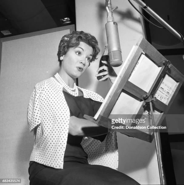 Entertainer Connie Francis records in the studio with producer Ray Ellis at MGM on July 10, 1959 in New York.