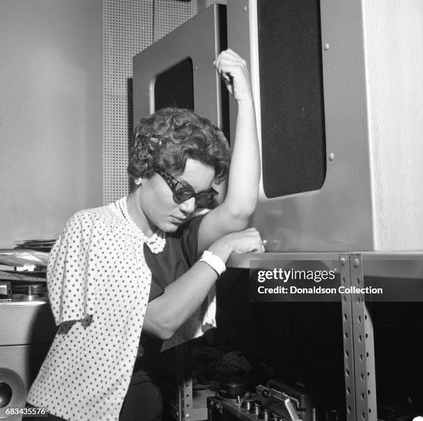 Entertainer Connie Francis records in the studio with producer Ray Ellis at MGM on July 10, 1959 in New York.