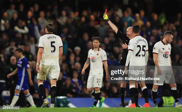 Sebastian Prodl of Watford is shown a red card by referee Lee Mason after picking up his second yellow of the game during the Premier League match...