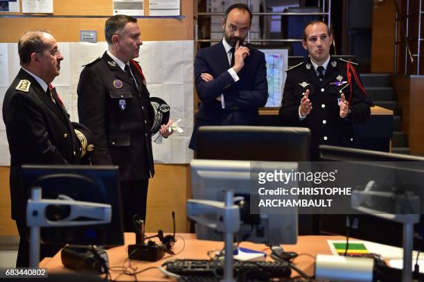 France's newly appointed Prime Minister Edouard Philippe gestures during his first official visit at the Police Prefecture of Paris on May 15, 2017....