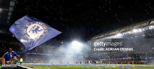 Streamers errupt over the pitch at the end of the English Premier League football match between Chelsea and Watford at Stamford Bridge in London on...