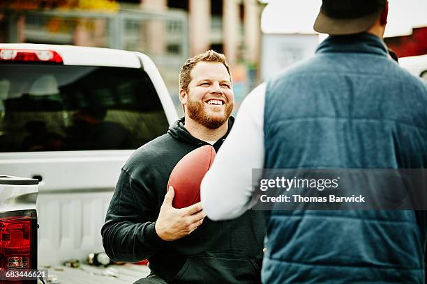 man hanging out during tailgating party - tailgate stock pictures, royalty-free photos & images