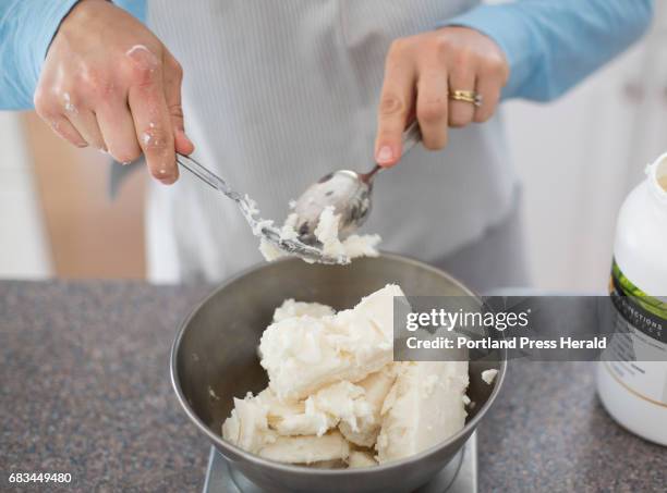 Margaret Morris runs Five Islands Body Co. And makes the products at her home in Brunswick. Morris measures shea butter while making hand cream on...