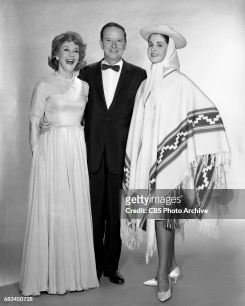 Advance photo session for the Miss Universe Beauty Pageant. Pictured from left is Arlene Francis, John Daly and Norma Beatriz Nolan of Argentina ....