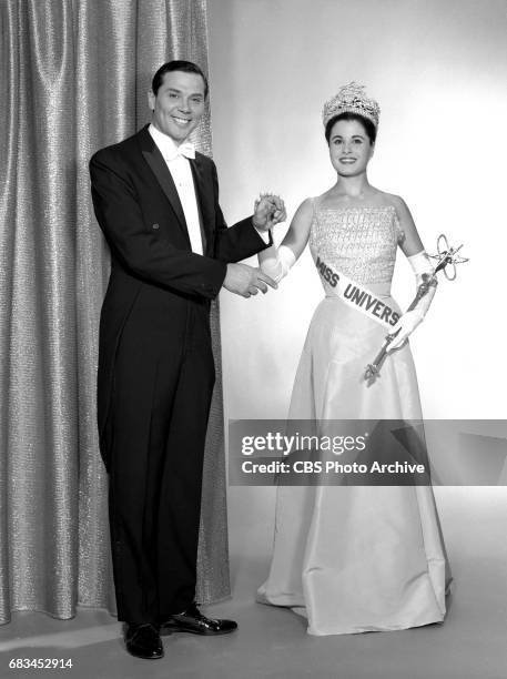 Advance photo session for the Miss Universe Beauty Pageant. Pictured is Gene Rayburn, emcee of the show from the stage and Norma Beatriz Nolan of...